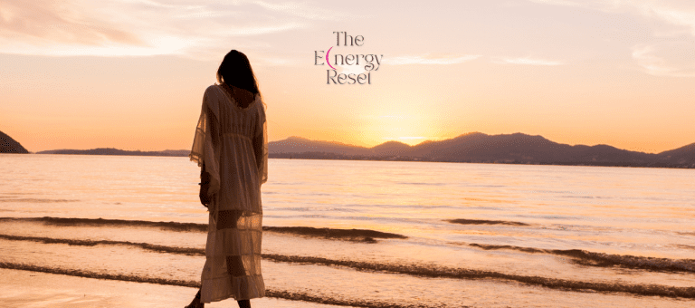 Woman walking along a beach